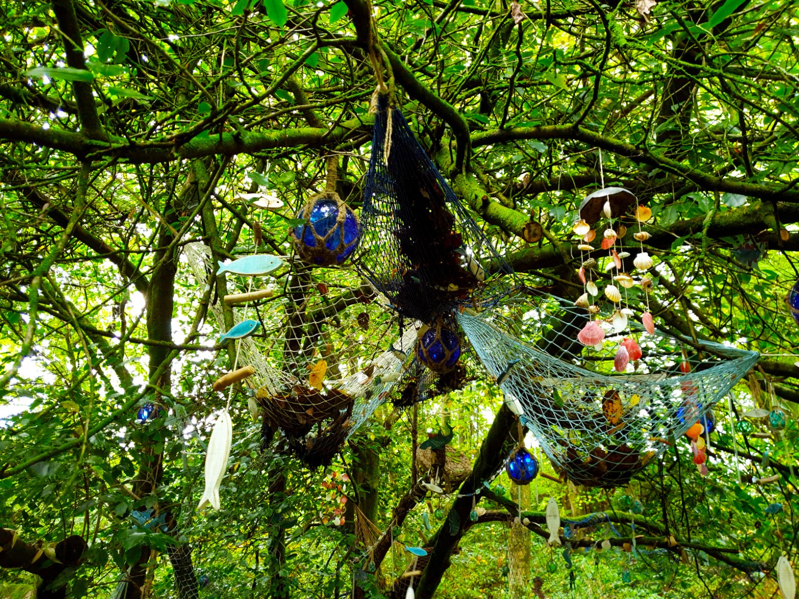 A collection of objects tied into the branches of a tree